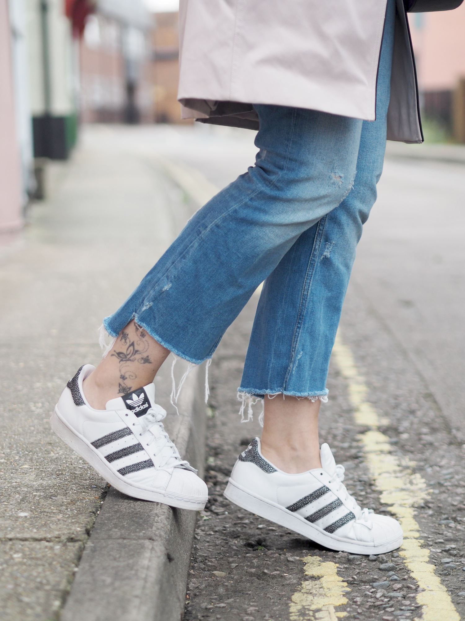 denim and Adidas trainers