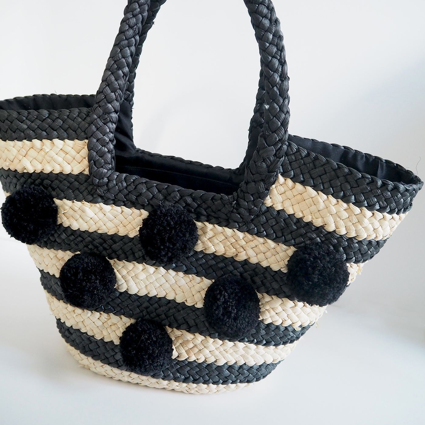 straw basket bag with pom poms