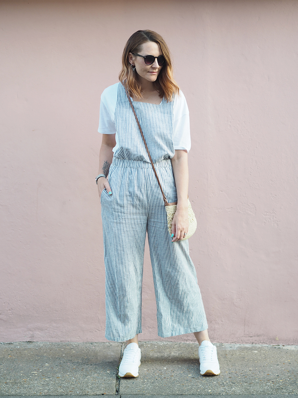 la Redoute striped jumpsuit casual summer outfit with trainers and straw bag