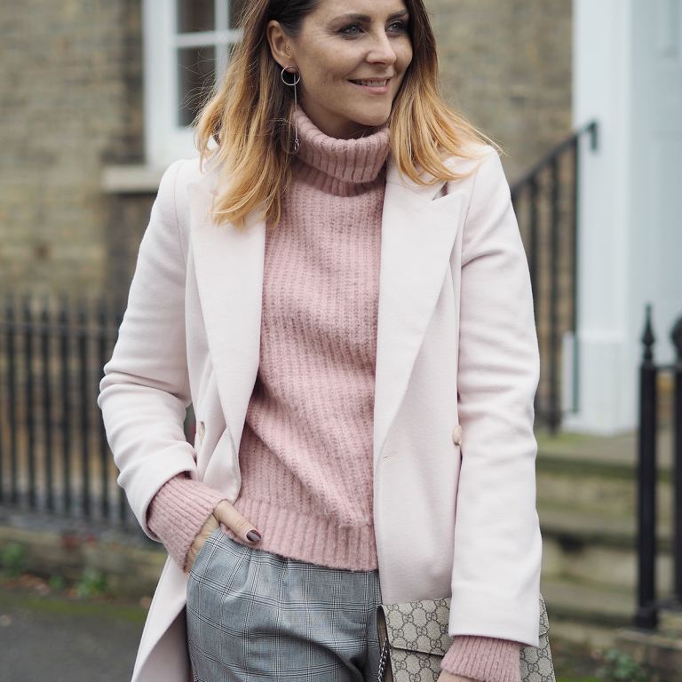 pink winter coat and pink jumper checked trousers outfit